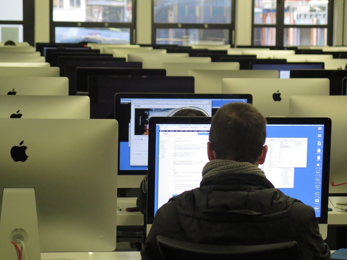 Image of people working in a computer lab.