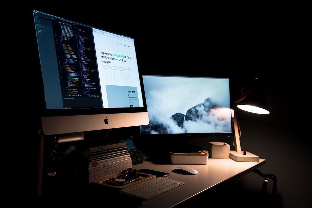 Image of website coding in a dark room.