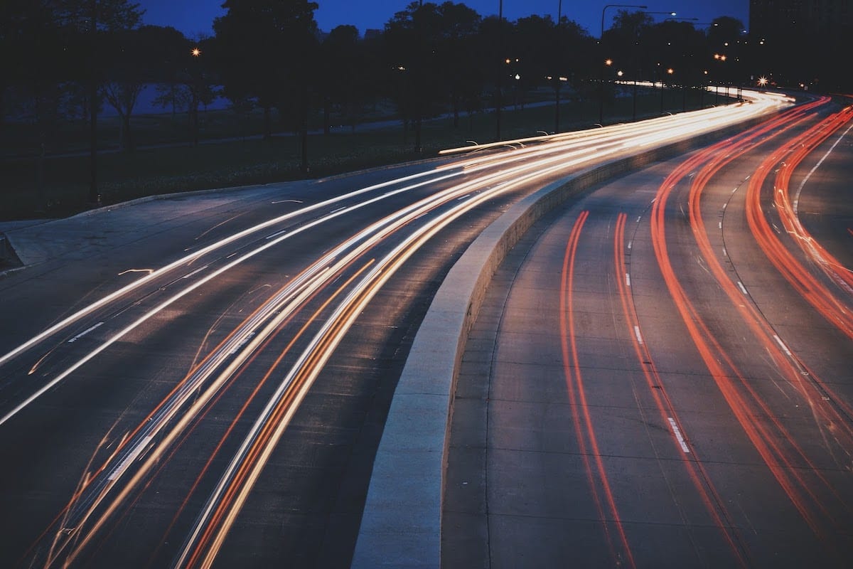 A time-lapse highway at night. 