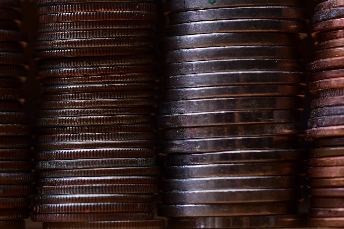 A close-up of coins piled high.
