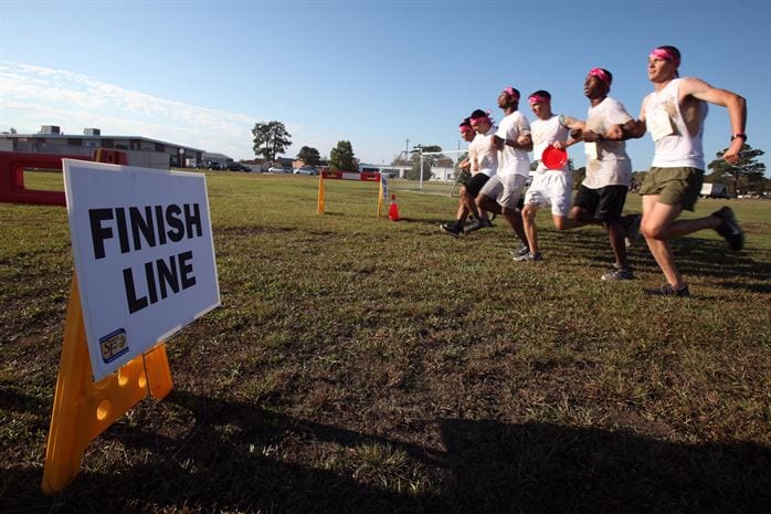 Men reaching a finish line.