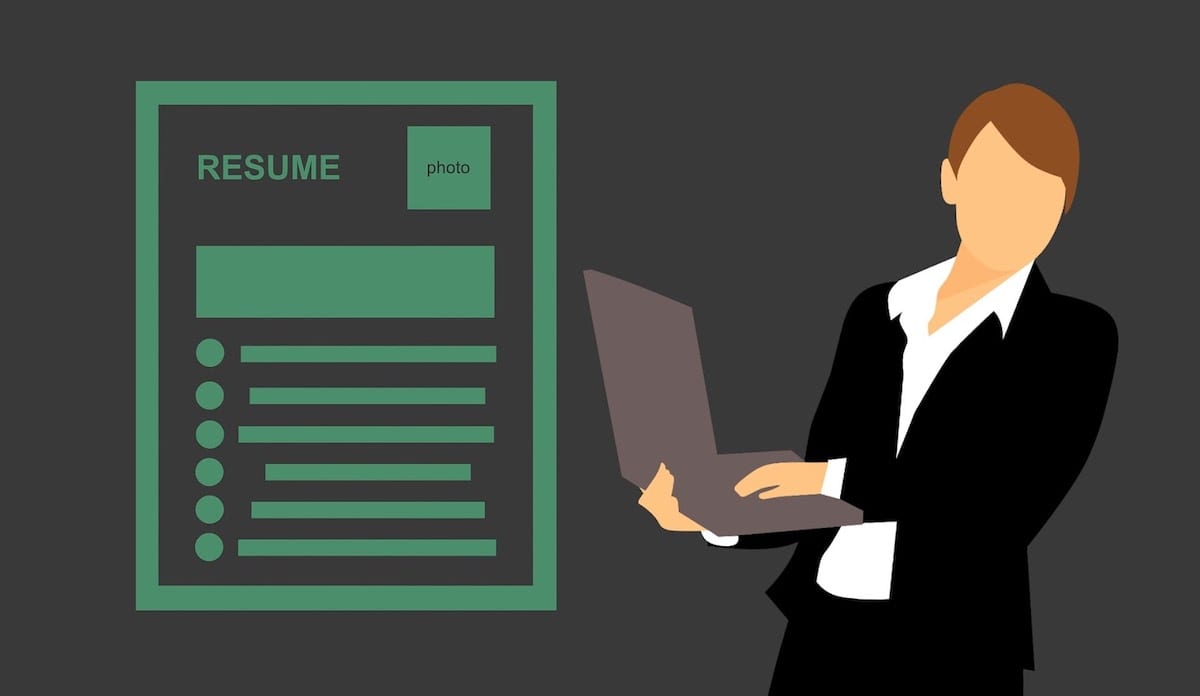 An animation of a resume and a business professional holding a laptop. 
