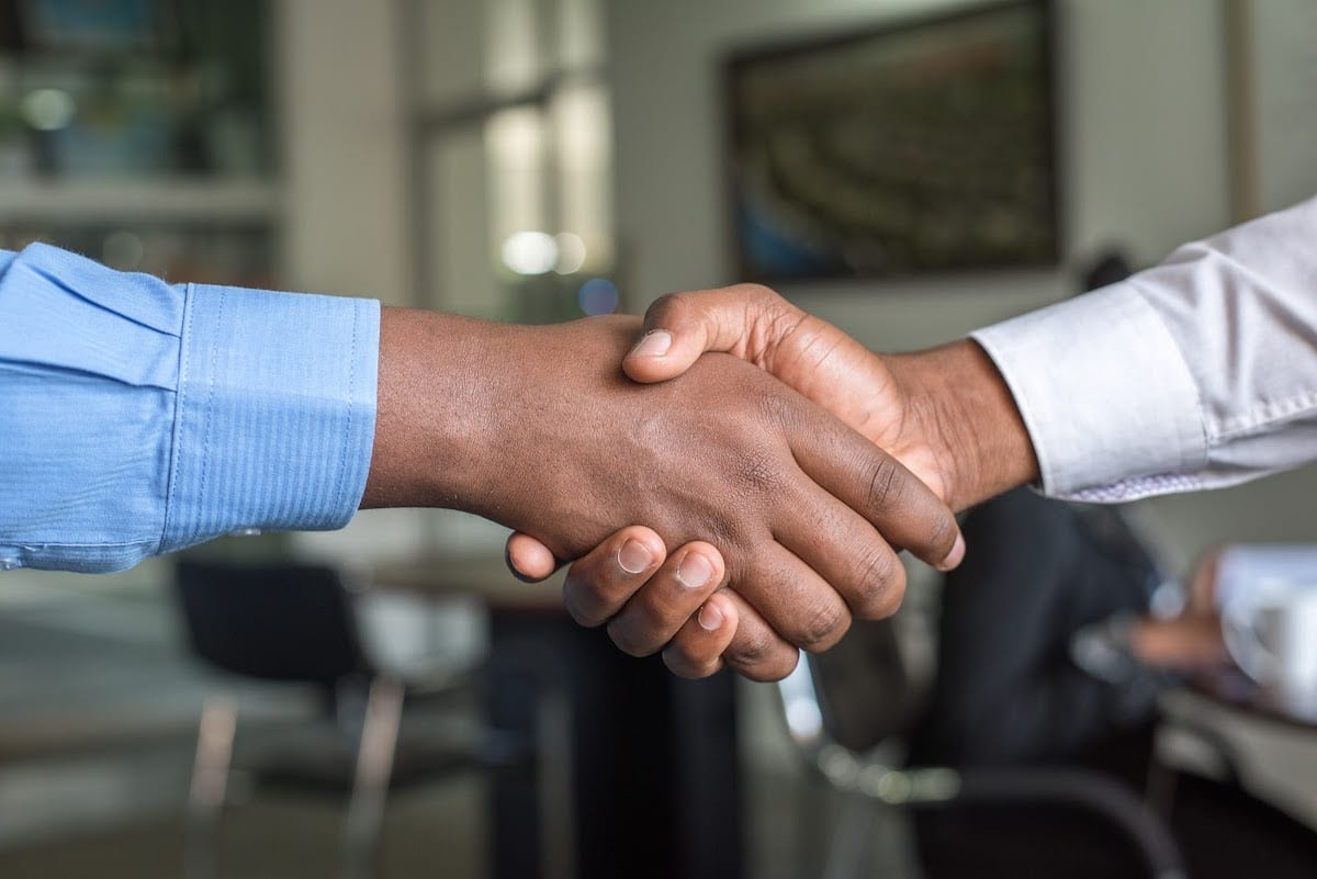 Two professionals shaking hands.