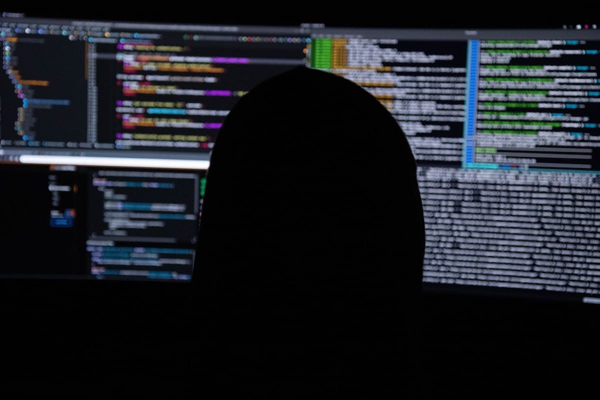 Image of a person coding.