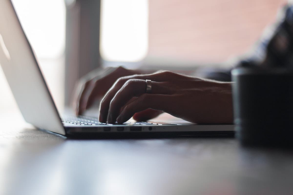  person typing on computer