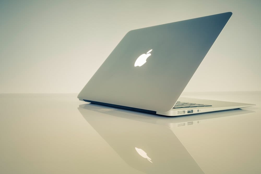 Laptop on a white table.