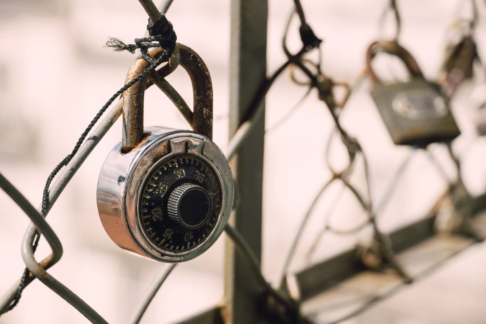  Image of a combination lock on a fence.