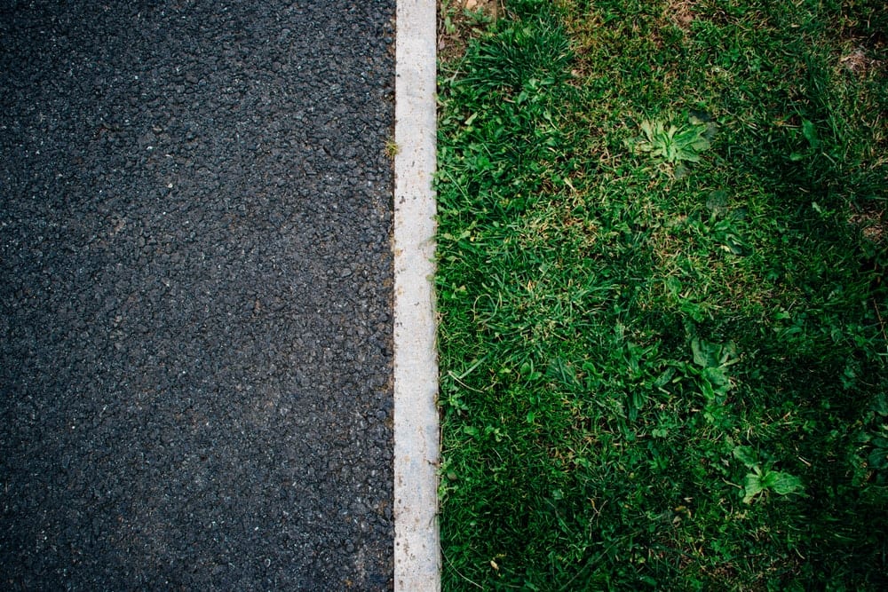 Asphalt and green grass