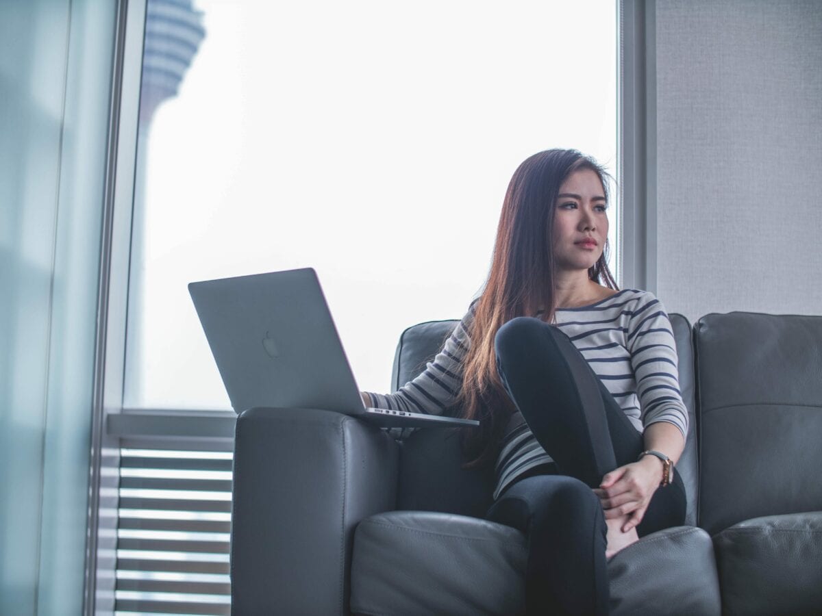 woman thinking about how to pay for coding bootcamp