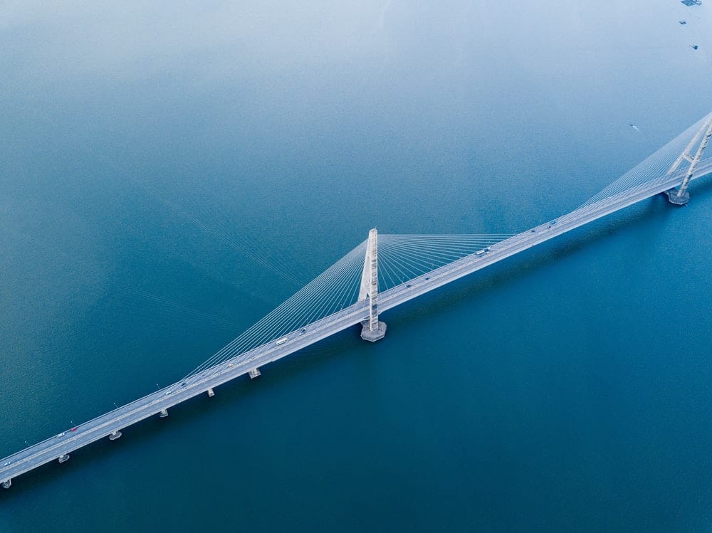 A bridge over blue water. 