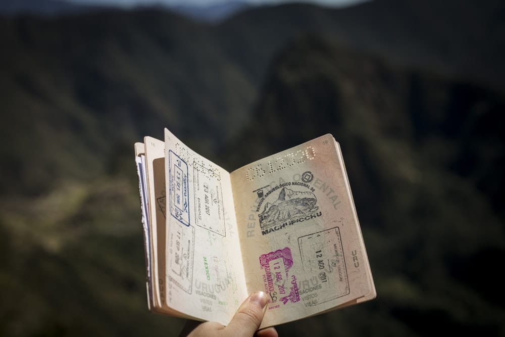 An open passport with various stamps. 