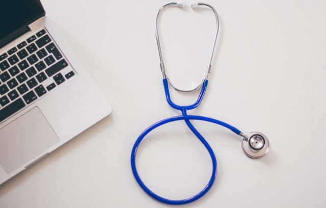 https://careerkarma.com/blog/wp-content/uploads/2019/11/computer-desk-laptop-stethoscope-48604.jpg