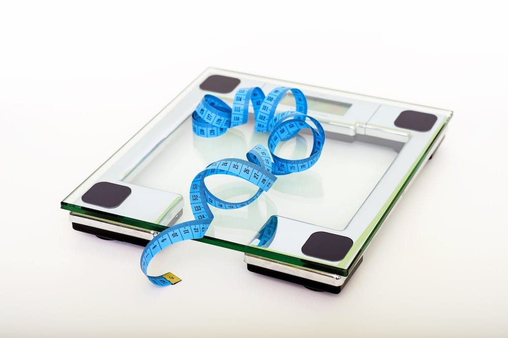 Blue Tape Measuring On Clear Glass Square Weighing Scale 53404