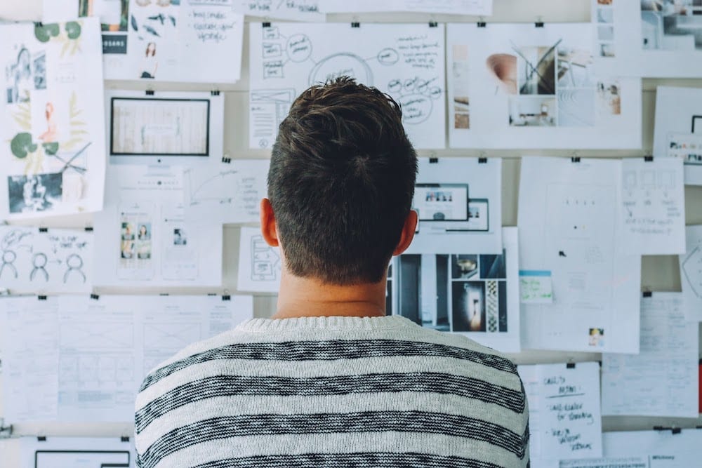 Man Wearing Black And White Stripe Shirt Looking At White 212286 2