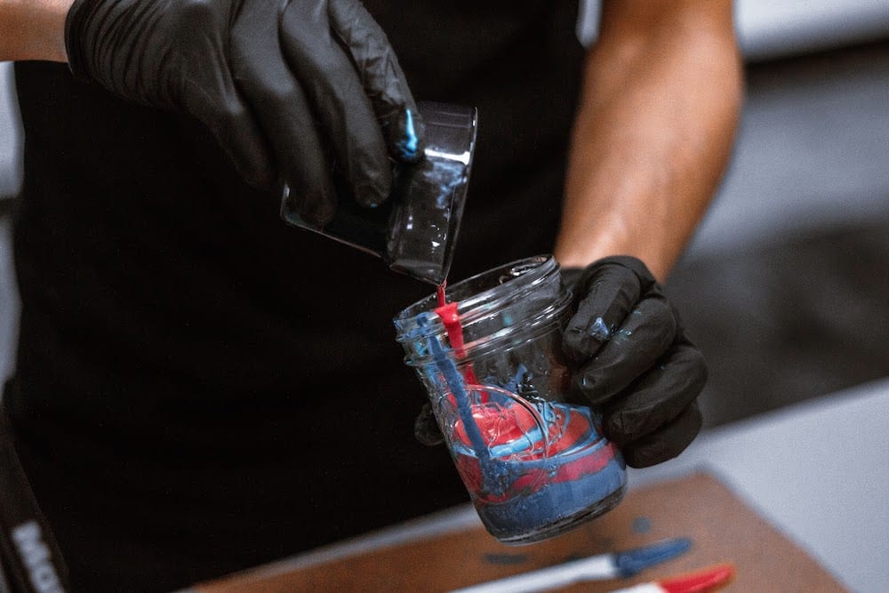 Photo Of Person Combining Acrylic Paints In Mason Jar 2471215