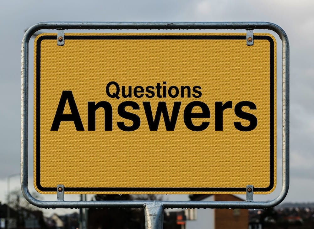 A sign with the words "Questions" and "Answers"