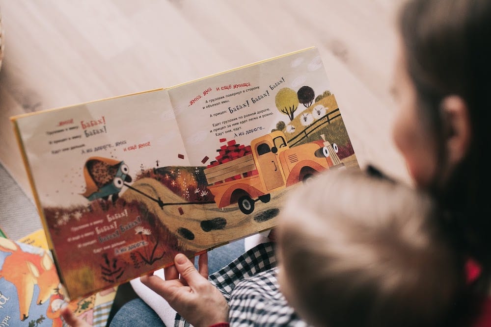 Woman Reading Book To Toddler 1741231