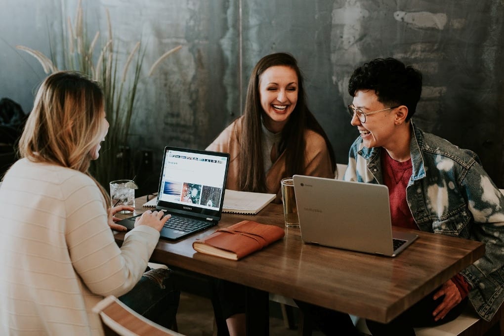 A group of people laughing together at work