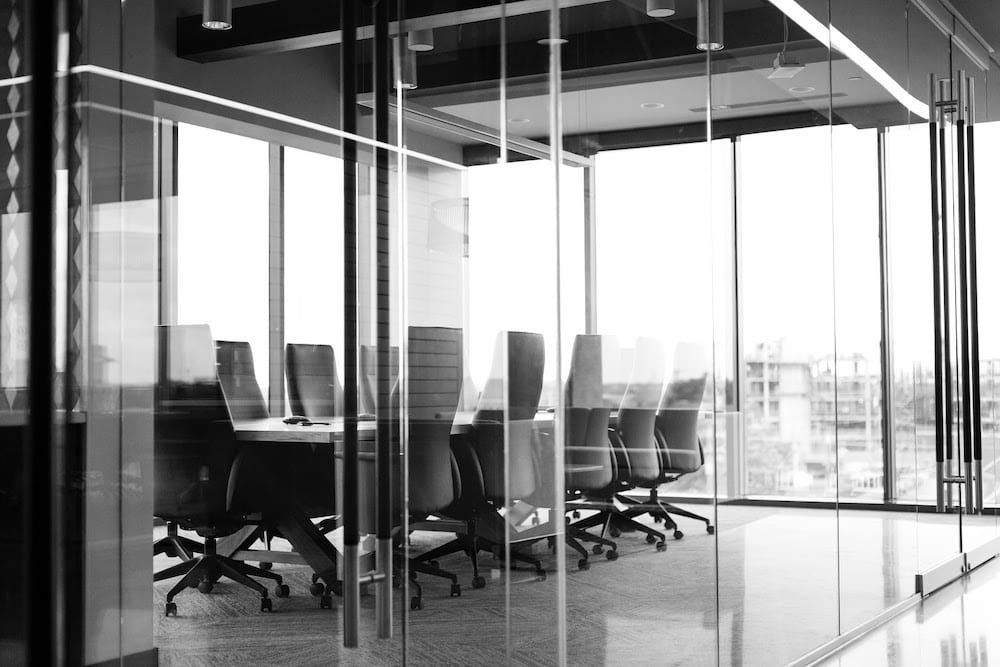 An empty conference room in black and white.