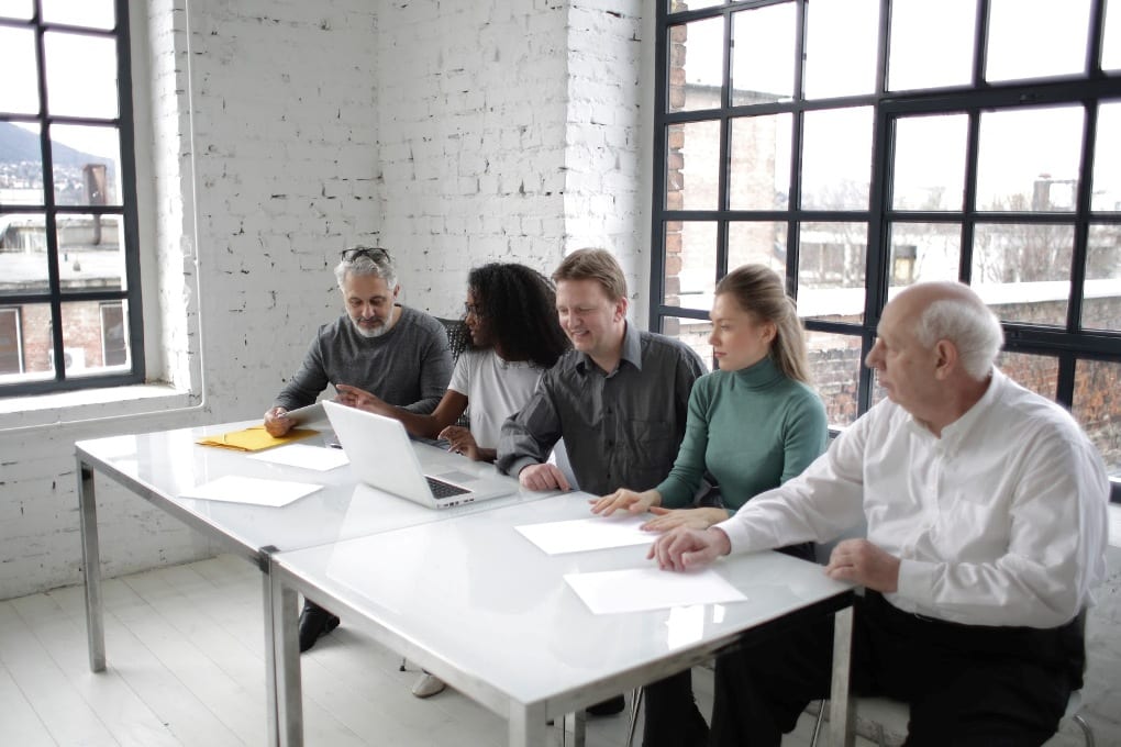 Five people in a meeting