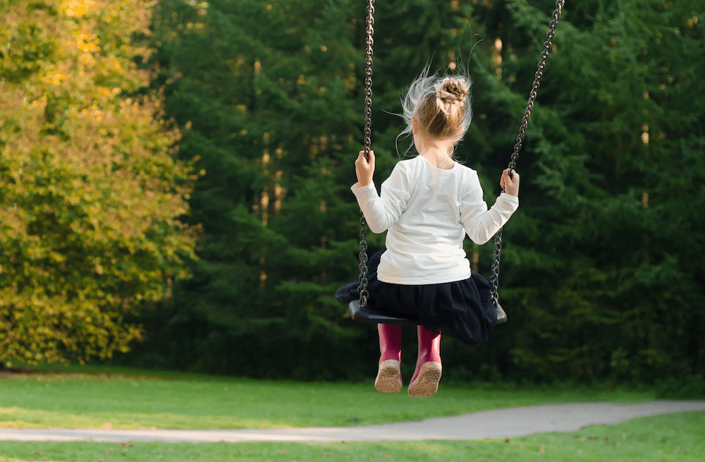 A girl on a swing.