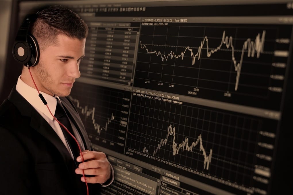 man looking at stock chart