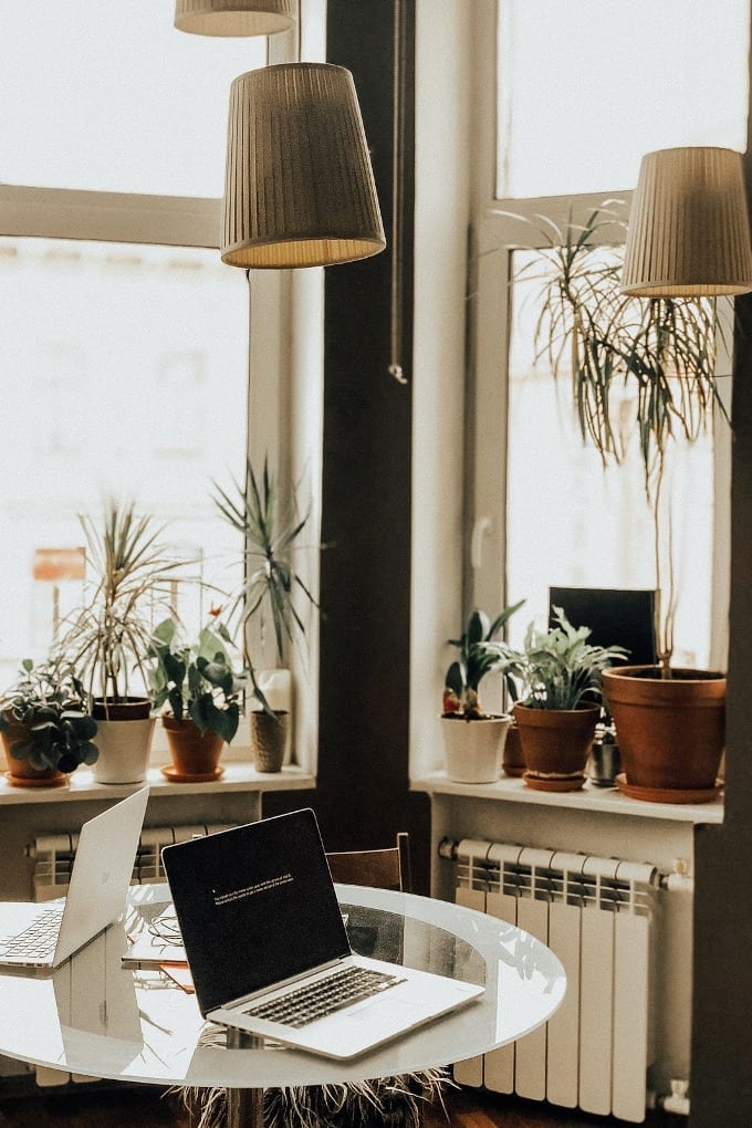 A cozy work corner surrounded by plants