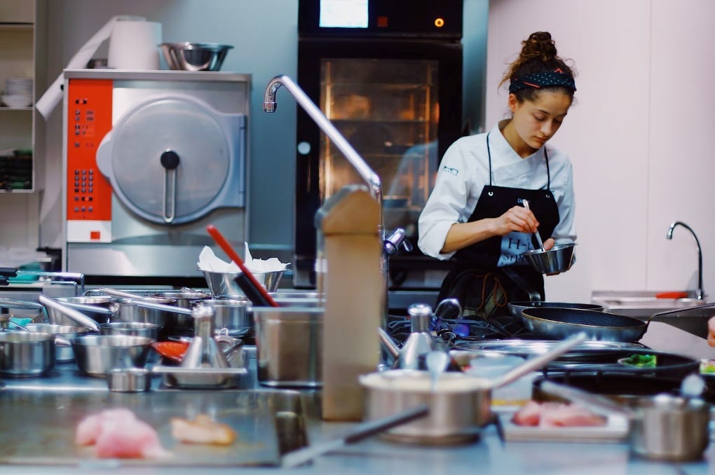 A person cooking in the kitchen