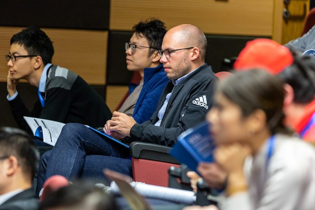 People sitting attentively in a classroom