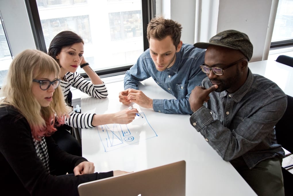 A General Assembly students discussing UX design. 