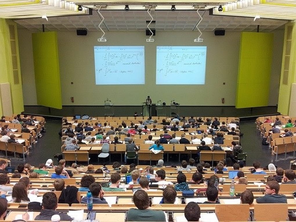 a large university lecture hall filled with students 