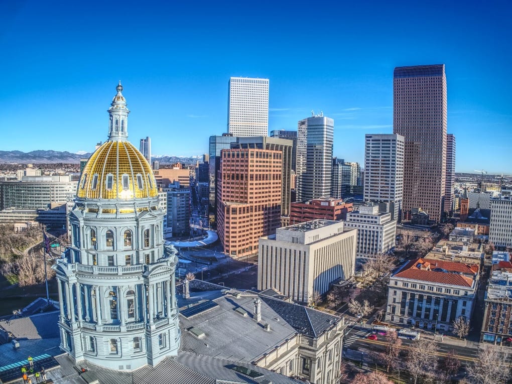 Downtown Denver Colorado view of the buildings and the mountains