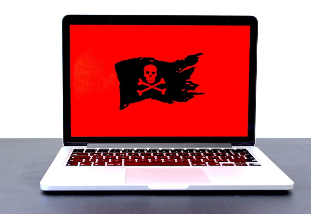 A red and black pirates flag on a laptop screen.