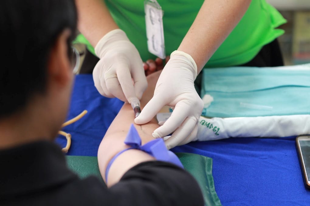 a person getting their blood sample taken