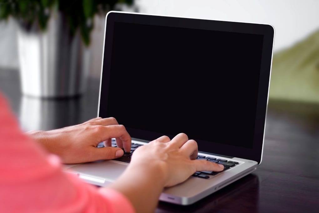 Person typing on laptop 