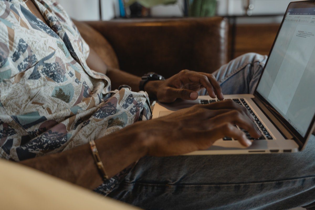 A bootcamp grad researching high-paying apprenticeship programs on a laptop 