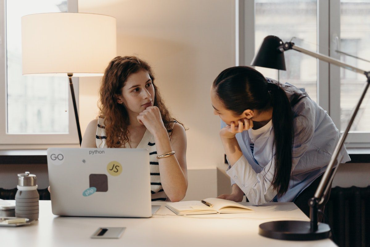 Women talking to each other in an office How to Become a Product Owner