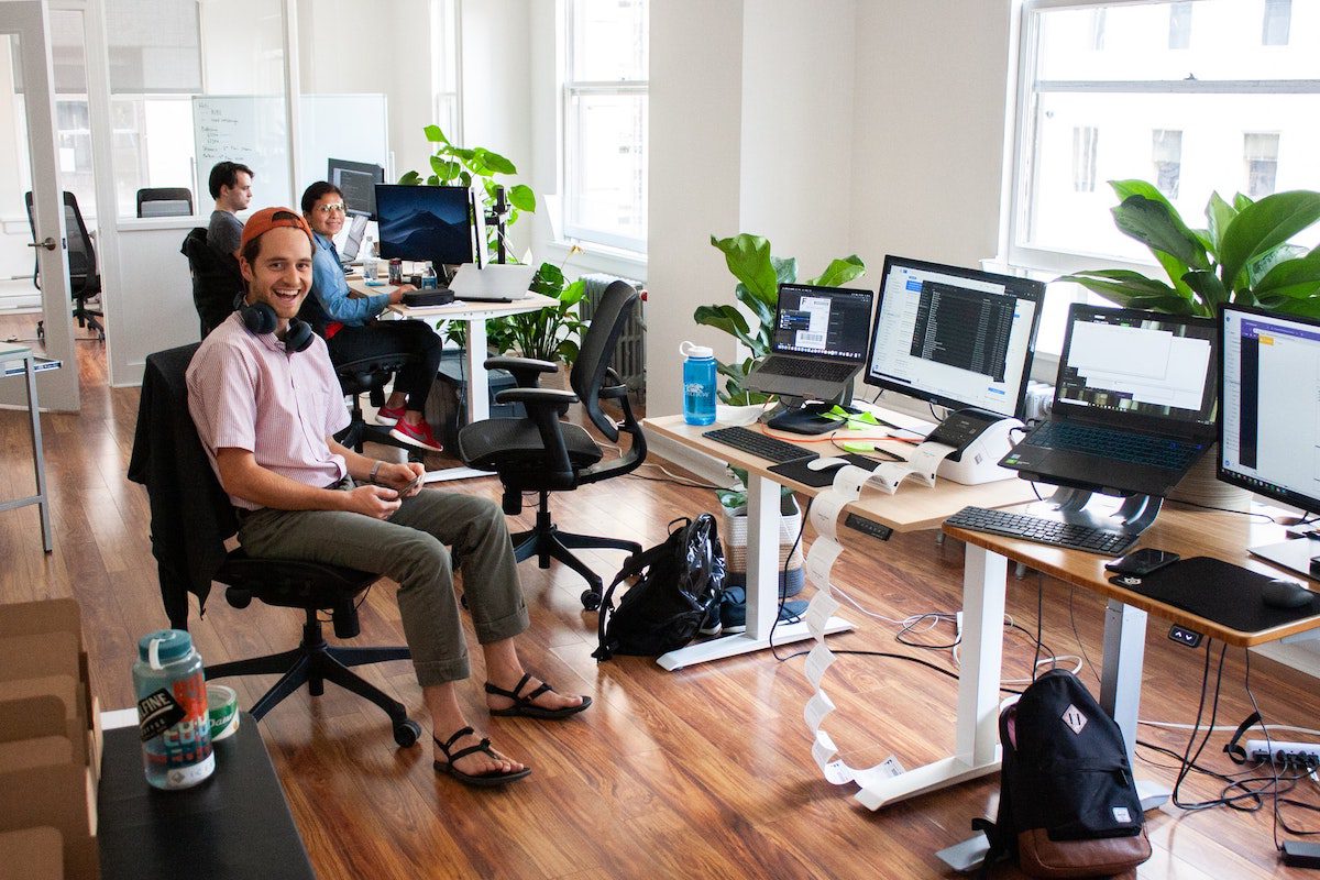 People laughing in a network architect office how to become a network architect