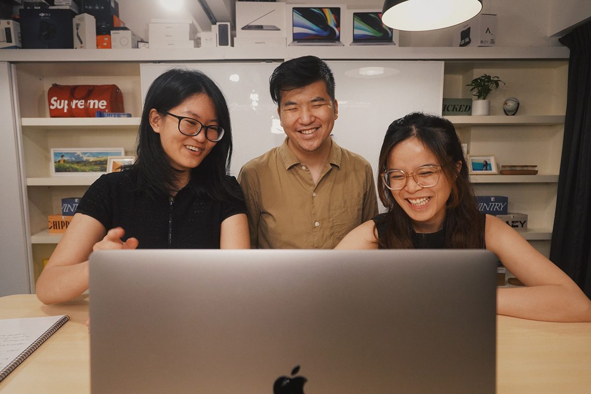 Three people smiling in a job interview. Director of Operations Interview Questions and Answers