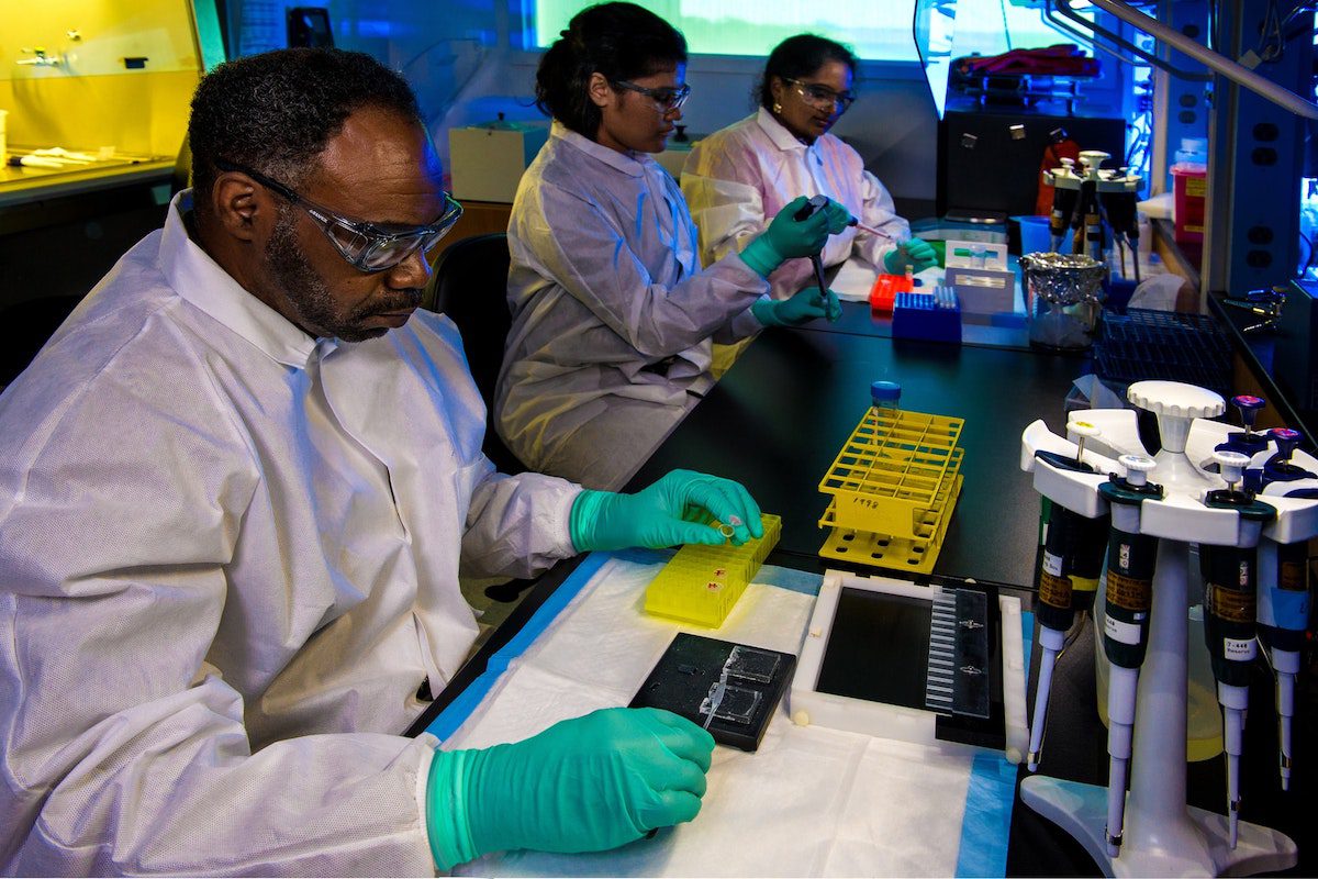 Scientists working in a lab. Python for Bioinformatics