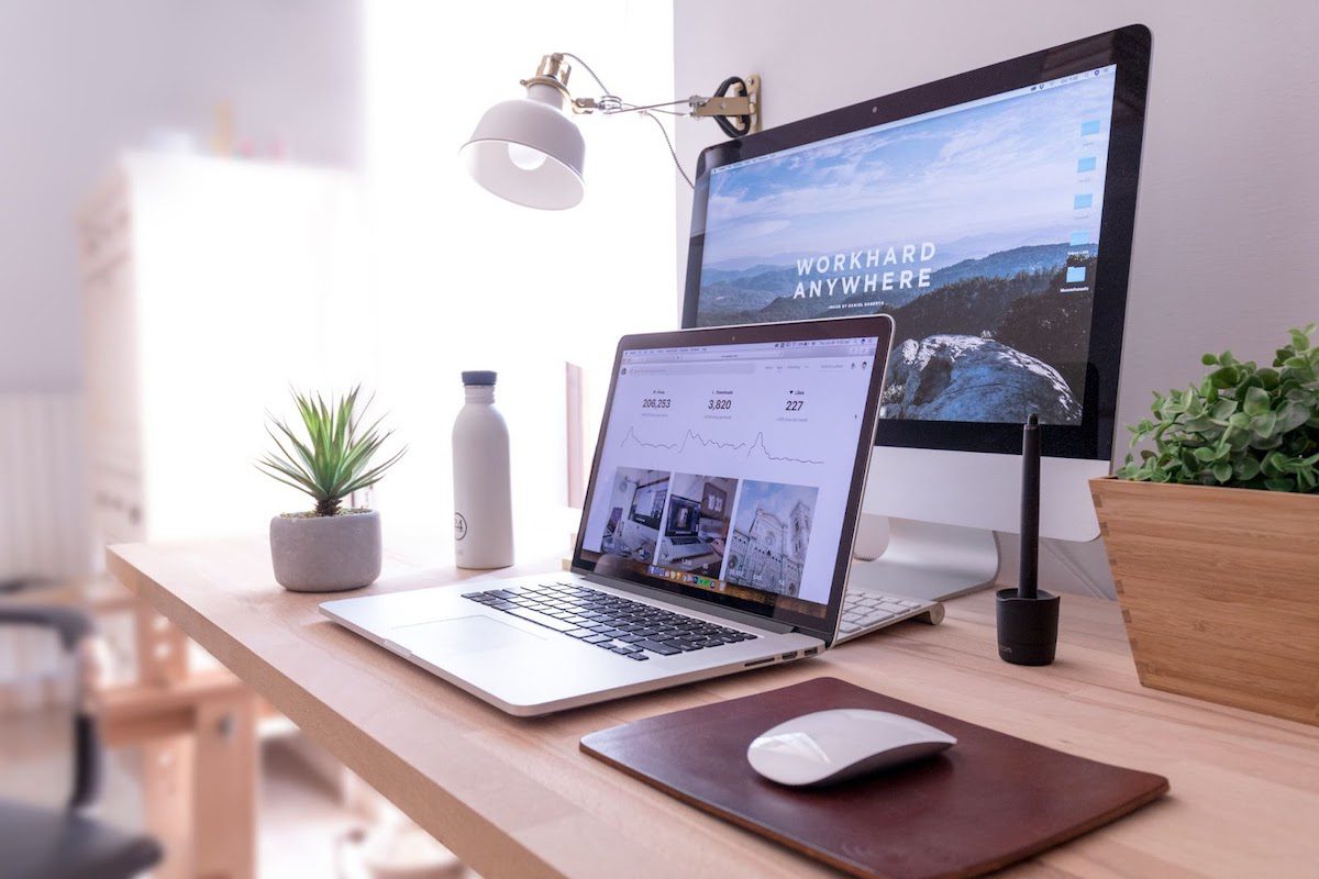 A laptop and a desktop computer showing a tech portfolio