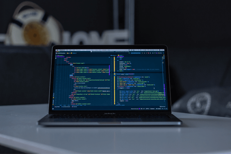 Macbook Pro showing lines of code.