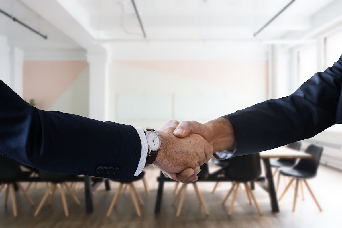 Two people shaking hands.