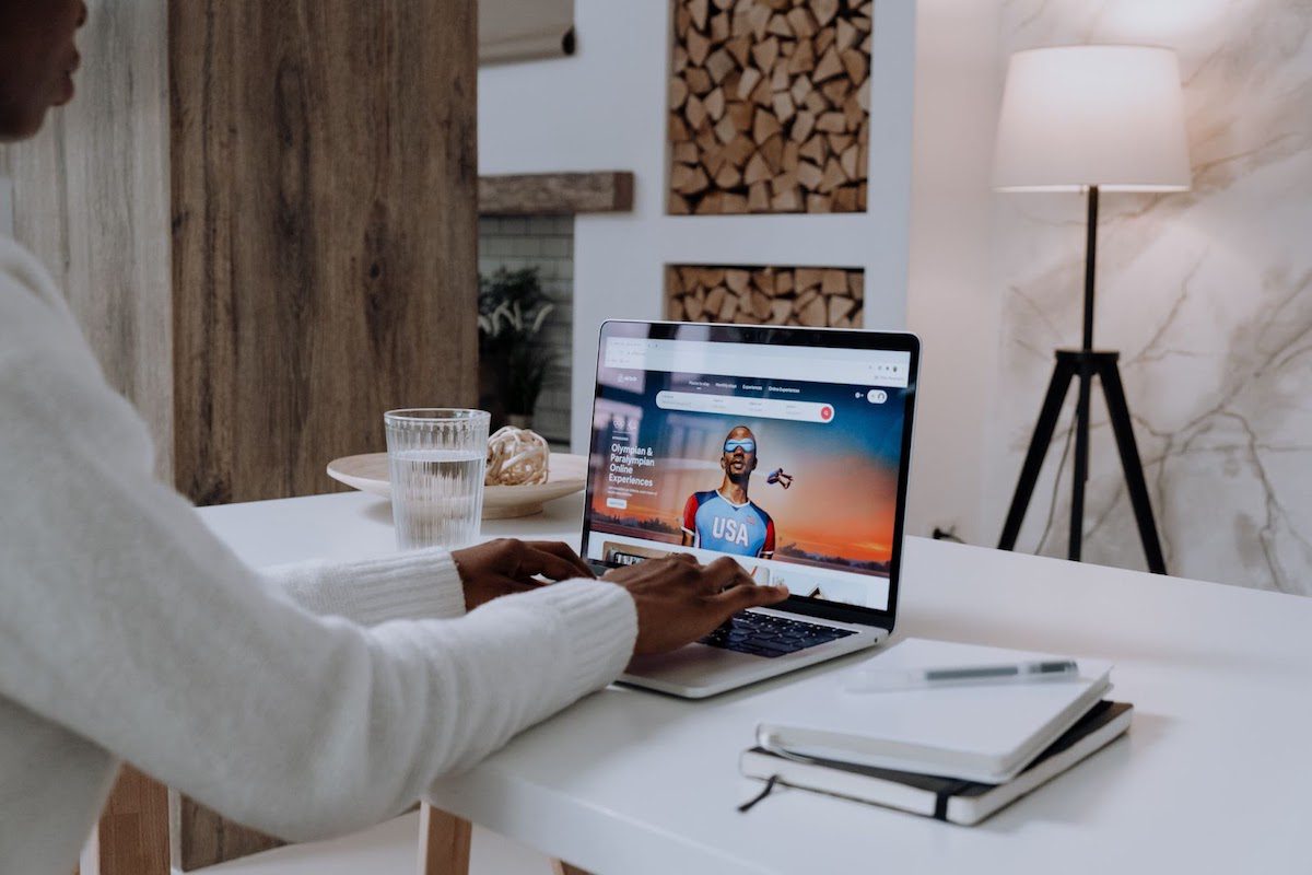 A man using a MacBook Pro computer.