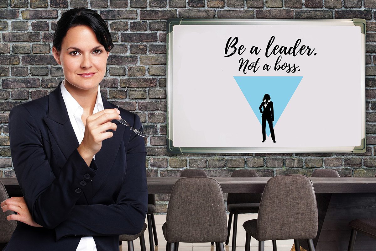 A senior employee standing in front of a whiteboard with a leadership message. Leadership Position Cover Letter