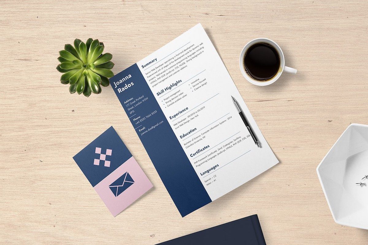 A resume placed on top of the table next to a coffee mug. Network Technician Cover Letter
