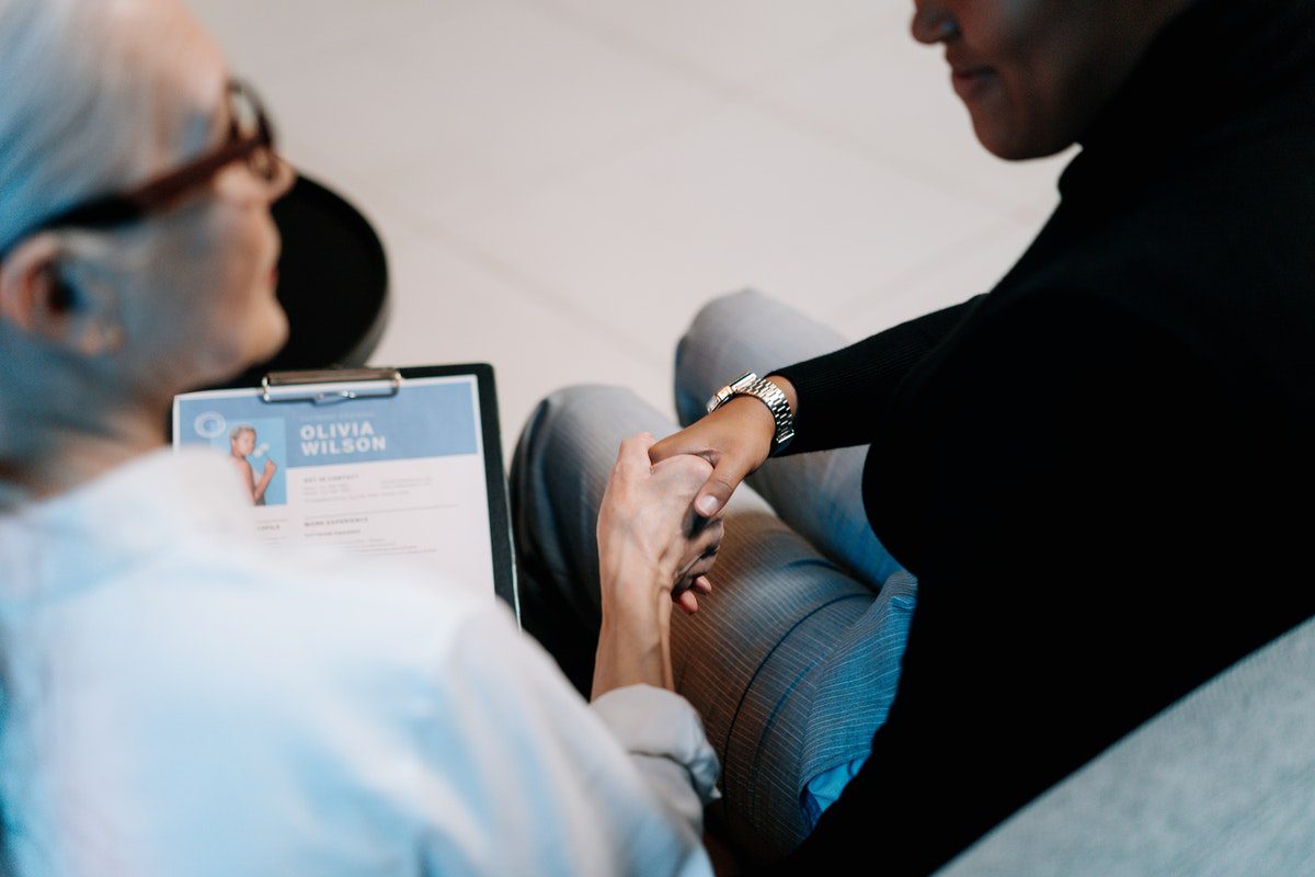 Women shaking hands after a job interview. Operations Manager Cover Letter