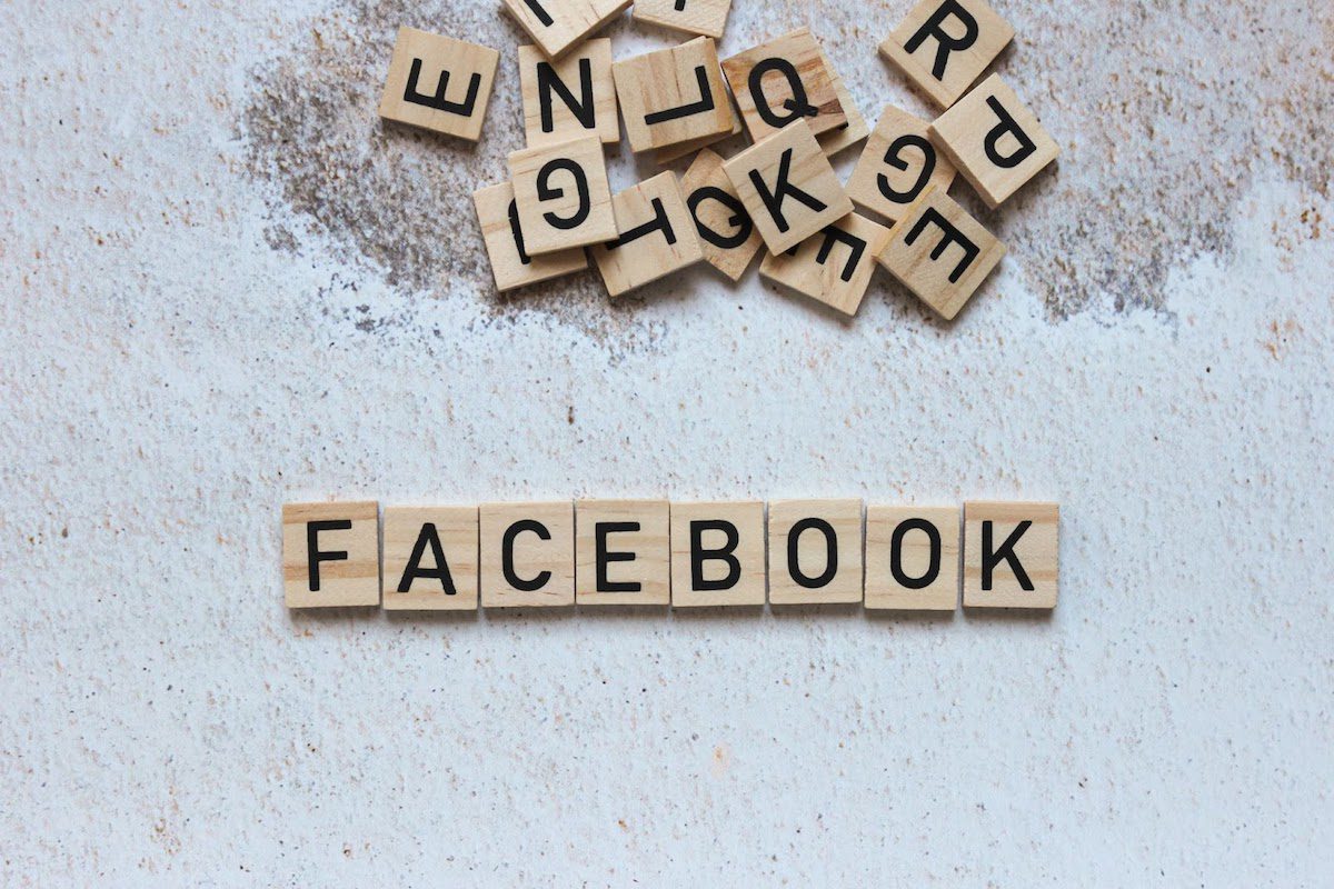 The word “Facebook” spelled out on brown wooden tiles