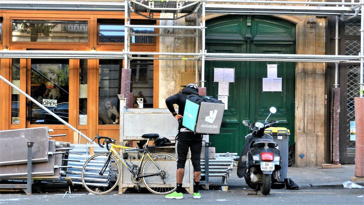 A Deliveroo driver picking up a customer’s order. 