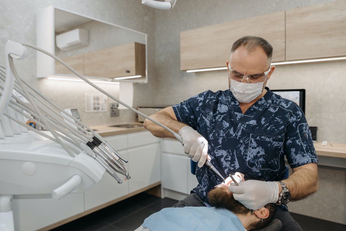 A periodontist attending a patient.